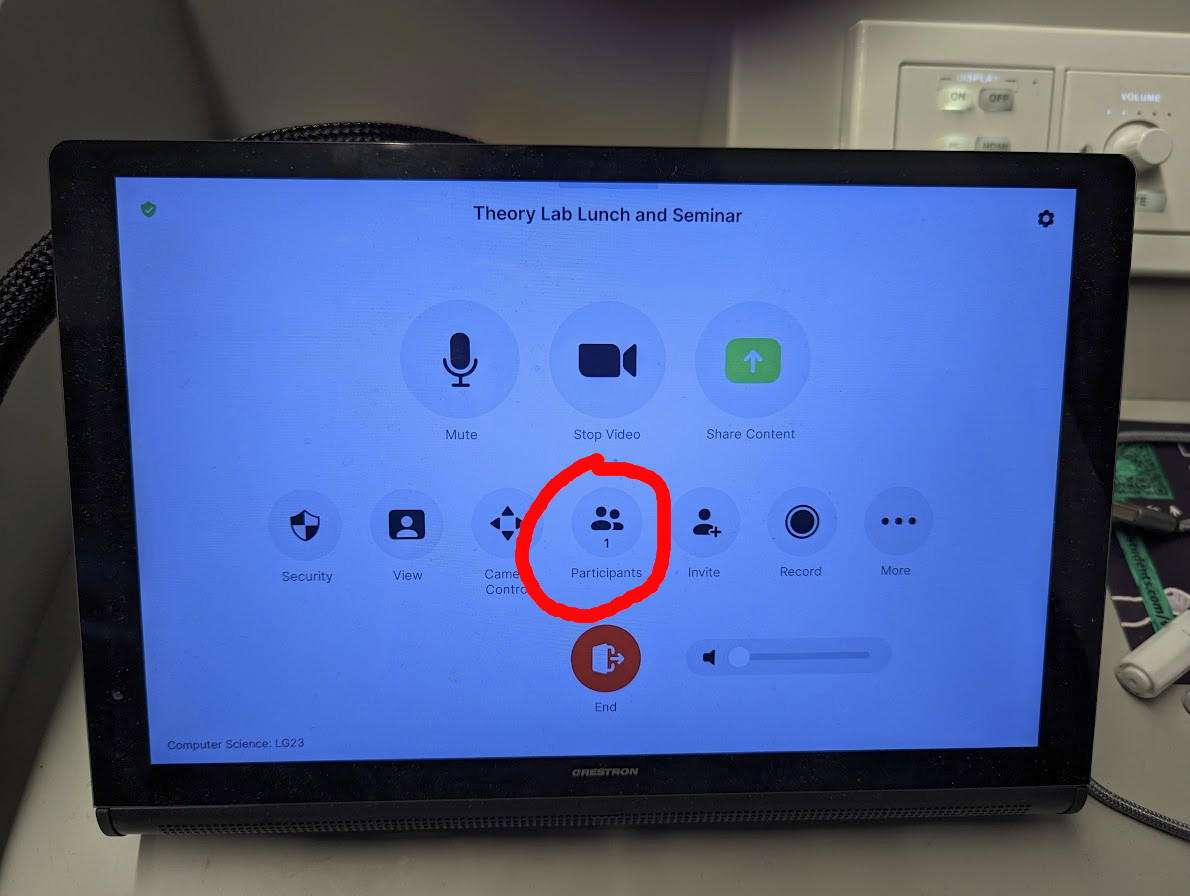 The zoom terminal shows the meeting controls, with 'Participants' circled.
